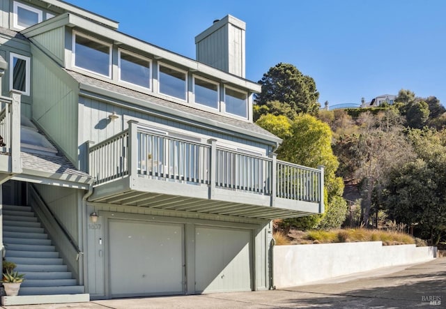 1837 Centro W St, Tiburon, CA 94920 - back of house with a shingled roof, stairway, and an attached garage