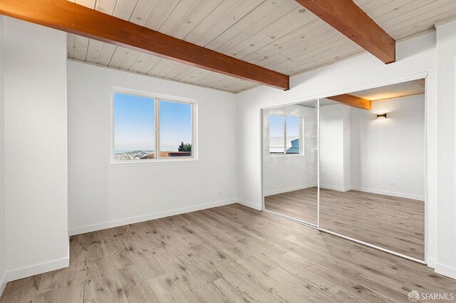 5407 Diamond Heights Blvd Unit 1, San Francisco, CA 94131 - unfurnished bedroom featuring multiple windows, wood finished floors, wood ceiling with exposed beams, and baseboards