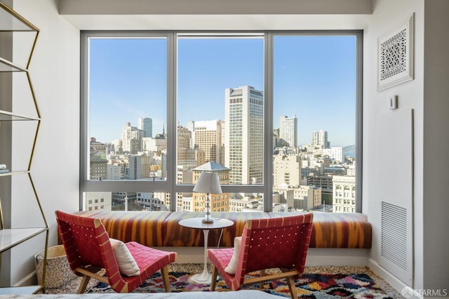 765 Market St Unit 28D, San Francisco, CA 94103 - sitting room featuring a skyline view and baseboards