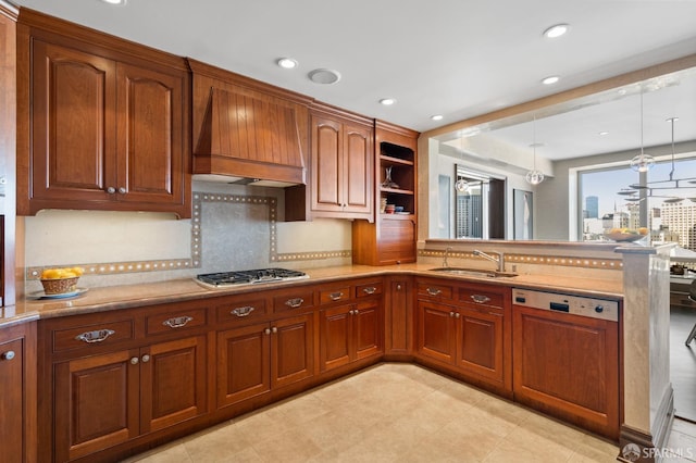 kitchen with stainless steel gas cooktop, hanging light fixtures, sink, paneled dishwasher, and premium range hood