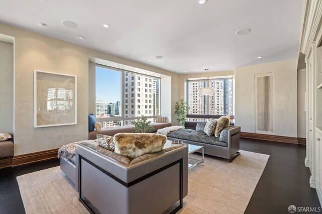 765 Market St Unit 28D, San Francisco, CA 94103 - living room featuring recessed lighting, a city view, baseboards, and wood finished floors