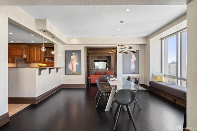 765 Market St Unit 28D, San Francisco, CA 94103 - dining space featuring a chandelier, baseboards, dark wood-style flooring, and recessed lighting