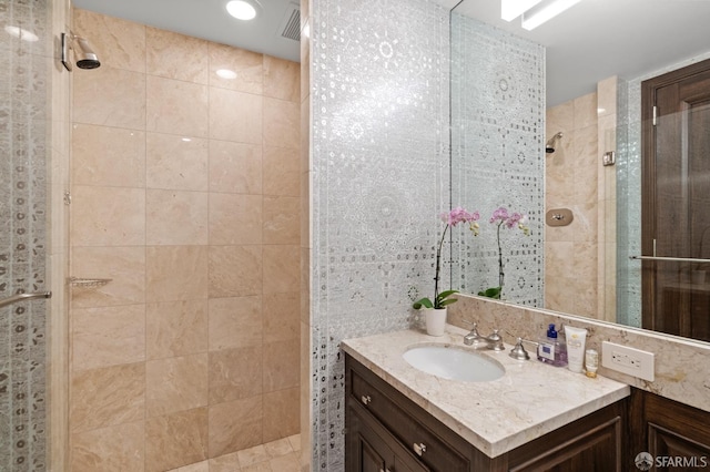765 Market St Unit 28D, San Francisco, CA 94103 - bathroom with a tile shower, vanity, and recessed lighting