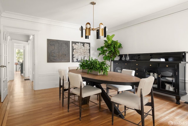 1828 Grove St, San Francisco, CA 94117 - dining space featuring a chandelier, light wood-style flooring, and crown molding