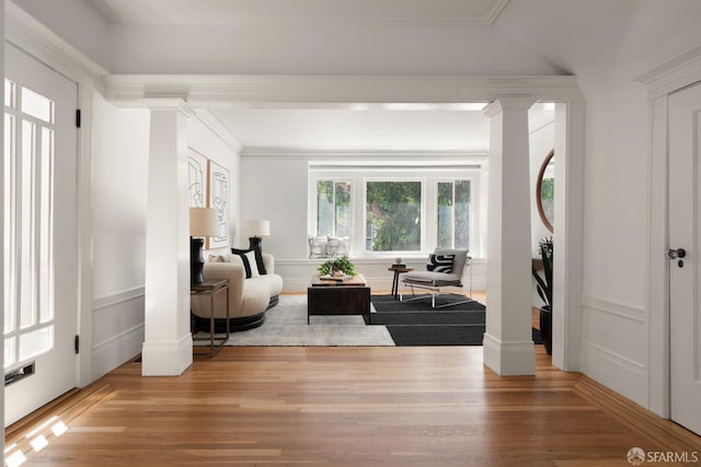 1828 Grove St, San Francisco, CA 94117 - living room with light wood-style flooring, a decorative wall, ornate columns, and crown molding