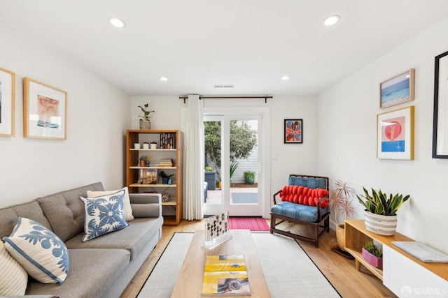 living area featuring recessed lighting and light wood-style flooring