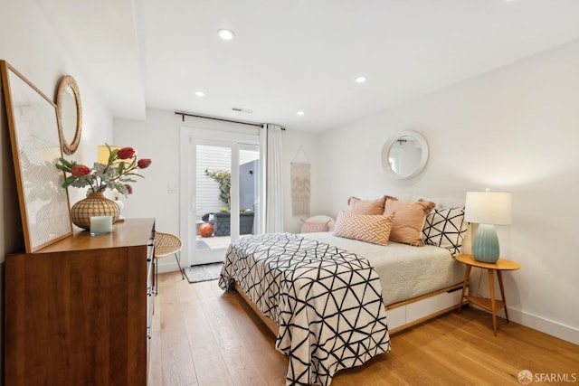 bedroom featuring light wood-type flooring, access to outside, baseboards, and recessed lighting