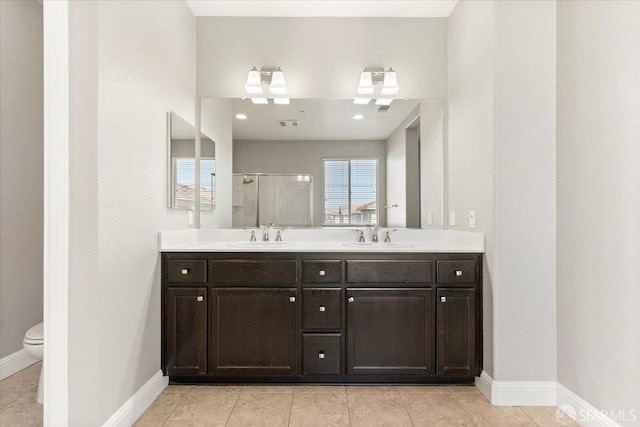 67 Greystone Pl, Pittsburg, CA 94565 - bathroom with a shower stall, baseboards, double vanity, toilet, and tile patterned floors