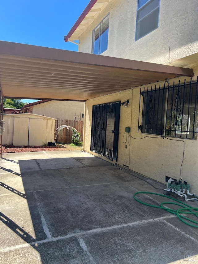 exterior space with a carport