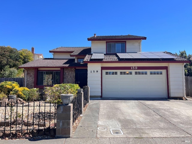 view of front of property with a garage