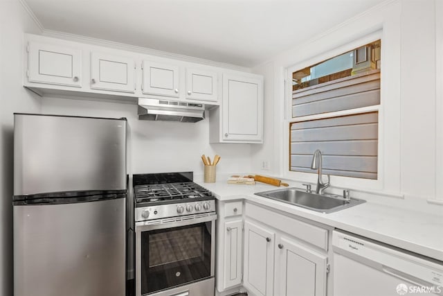 kitchen featuring stainless steel appliances, white cabinetry, sink, and crown molding