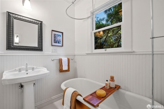 bathroom featuring a bathing tub and sink