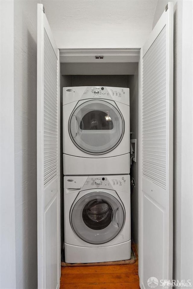 laundry room featuring stacked washer / dryer