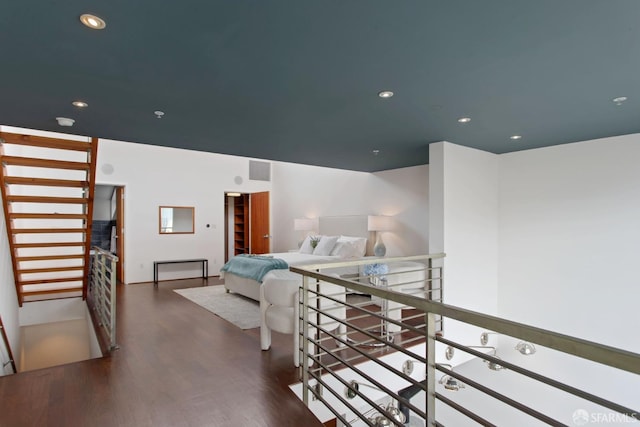 bedroom with visible vents, wood finished floors, and recessed lighting