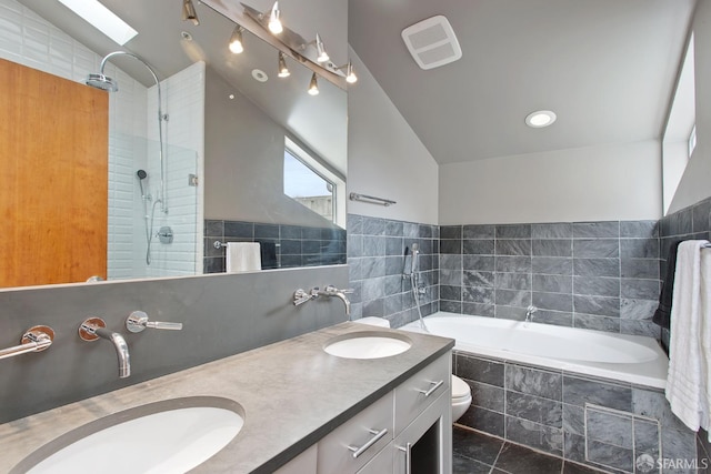 bathroom with lofted ceiling, tiled shower, a sink, and visible vents