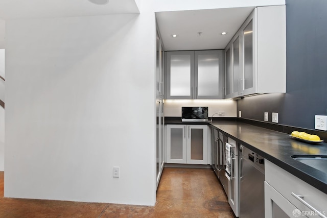 kitchen featuring dark countertops, recessed lighting, glass insert cabinets, white cabinetry, and dishwasher