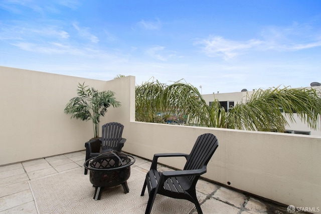 view of patio featuring a fire pit