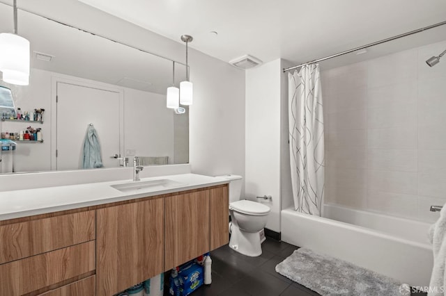 bathroom featuring tile patterned floors, toilet, vanity, and shower / bath combo with shower curtain