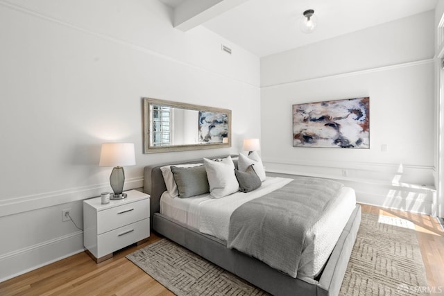 115 Magnolia St, San Francisco, CA 94123 - bedroom featuring beam ceiling, visible vents, and light wood-style flooring