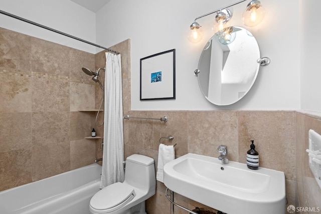 115 Magnolia St, San Francisco, CA 94123 - bathroom featuring shower / bath combo with shower curtain, wainscoting, toilet, tile walls, and a sink
