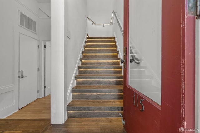 115 Magnolia St, San Francisco, CA 94123 - stairs featuring visible vents and wood finished floors