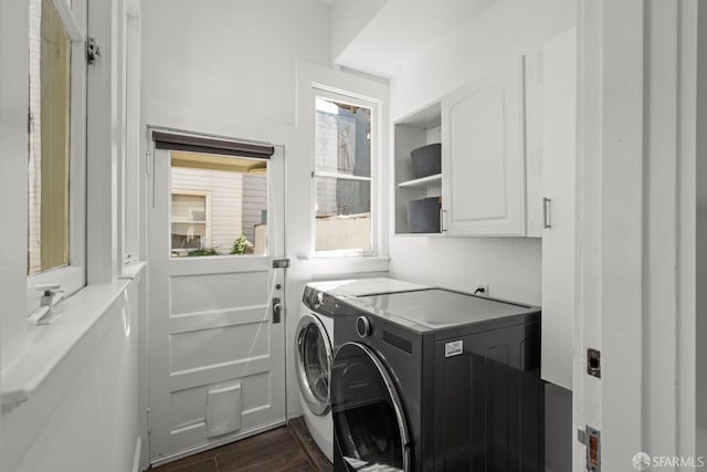 115 Magnolia St, San Francisco, CA 94123 - clothes washing area featuring dark wood-type flooring, washer and clothes dryer, and cabinet space