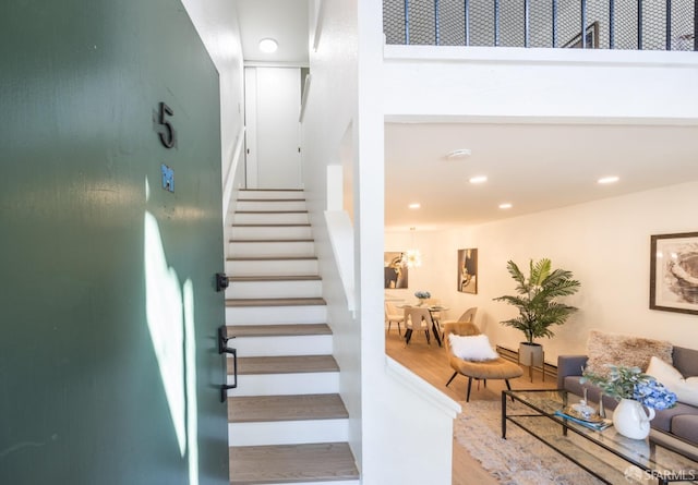 stairway featuring hardwood / wood-style flooring