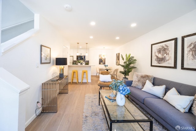 living room with light hardwood / wood-style floors