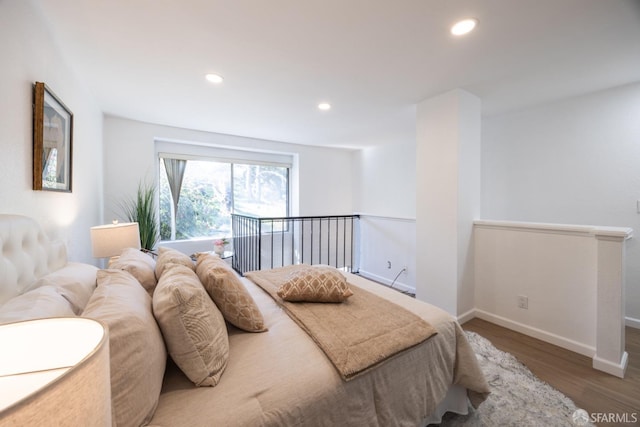 bedroom with wood-type flooring