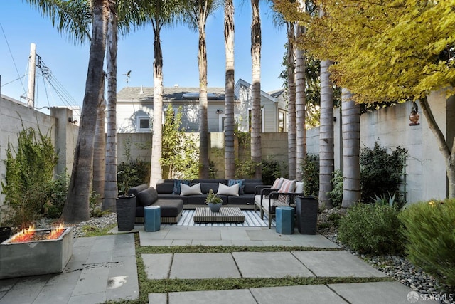 view of patio / terrace featuring an outdoor living space with a fire pit