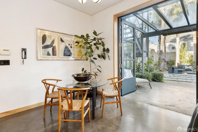 dining room with concrete flooring