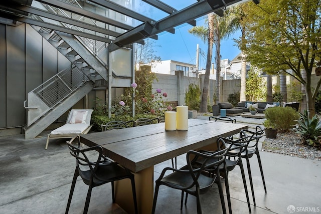 view of patio / terrace with outdoor lounge area and a pergola