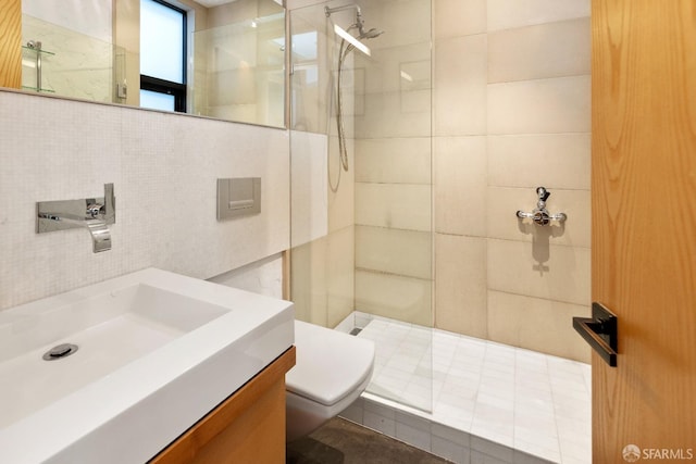 bathroom featuring vanity, toilet, tile walls, and an enclosed shower