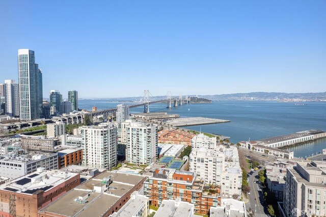 birds eye view of property featuring a view of city and a water view