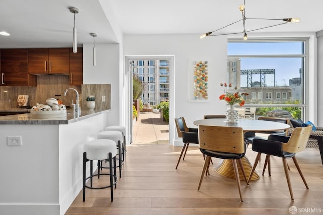 dining space with light wood-type flooring