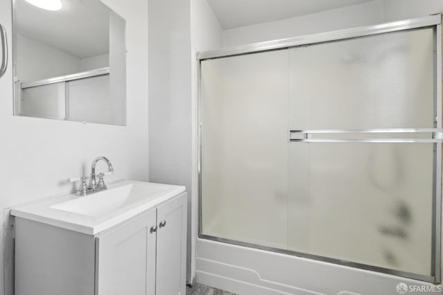 full bath featuring enclosed tub / shower combo and vanity