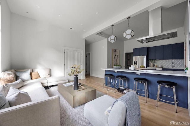 3447 20th St, San Francisco, CA 94110 - living room featuring light wood finished floors and a high ceiling