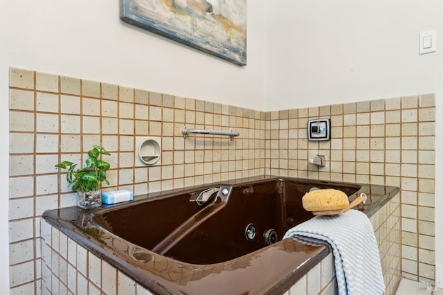308 E Strawberry Dr, Mill Valley, CA 94941 - bathroom featuring a jetted tub and tile walls