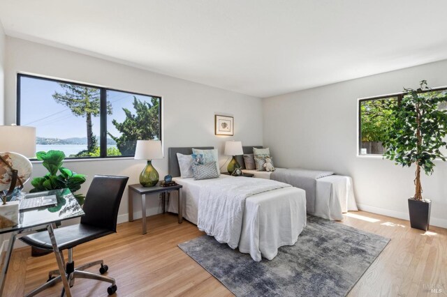 308 E Strawberry Dr, Mill Valley, CA 94941 - bedroom featuring light wood-style flooring, an office area, and baseboards