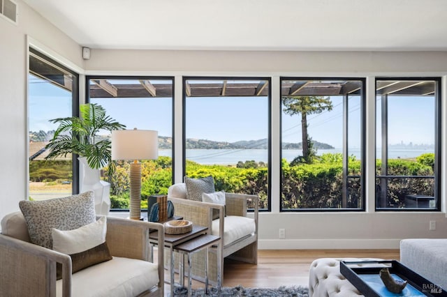 308 E Strawberry Dr, Mill Valley, CA 94941 - sitting room with wood finished floors, a water view, and baseboards