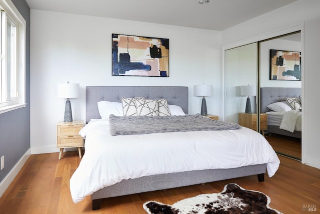 bedroom featuring a closet and hardwood / wood-style floors