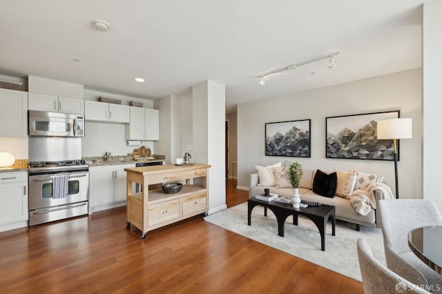 81 Frank Norris St Unit 701, San Francisco, CA 94109 - living room featuring wood finished floors, recessed lighting, and rail lighting