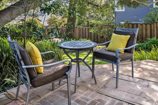 view of patio / terrace featuring fence