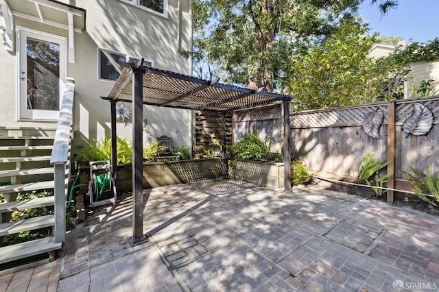 view of patio / terrace featuring a pergola and a fenced backyard