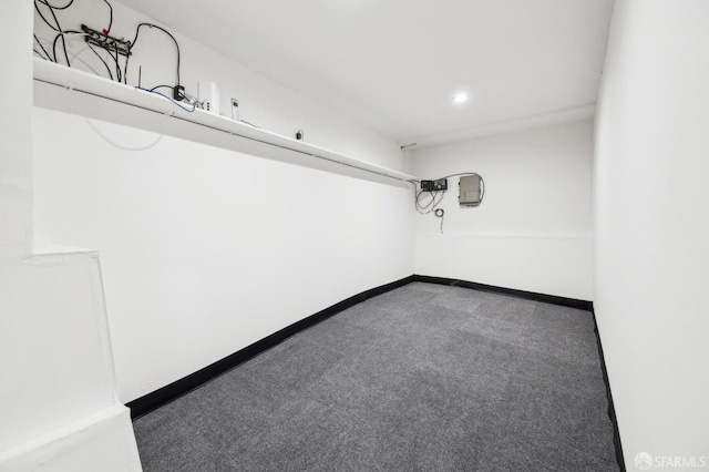 empty room featuring carpet flooring, recessed lighting, and baseboards