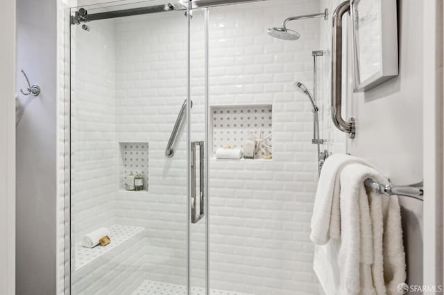 bathroom with a shower stall