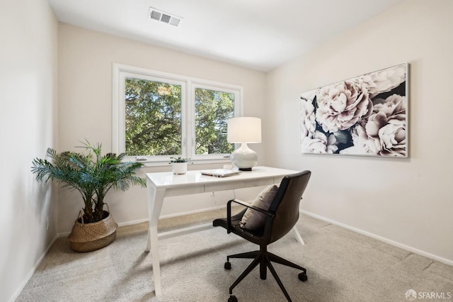 carpeted office featuring baseboards and visible vents