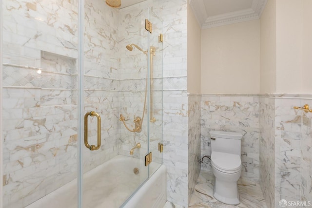 full bath featuring a wainscoted wall, toilet, ornamental molding, tile walls, and enclosed tub / shower combo