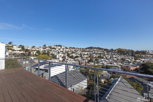 wooden deck featuring a residential view