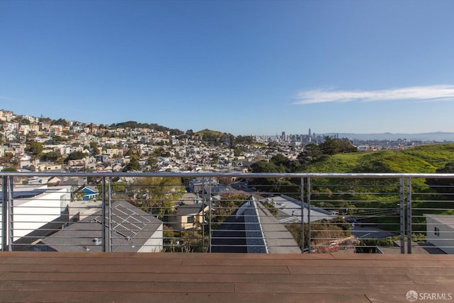 exterior space with a view of city and a balcony